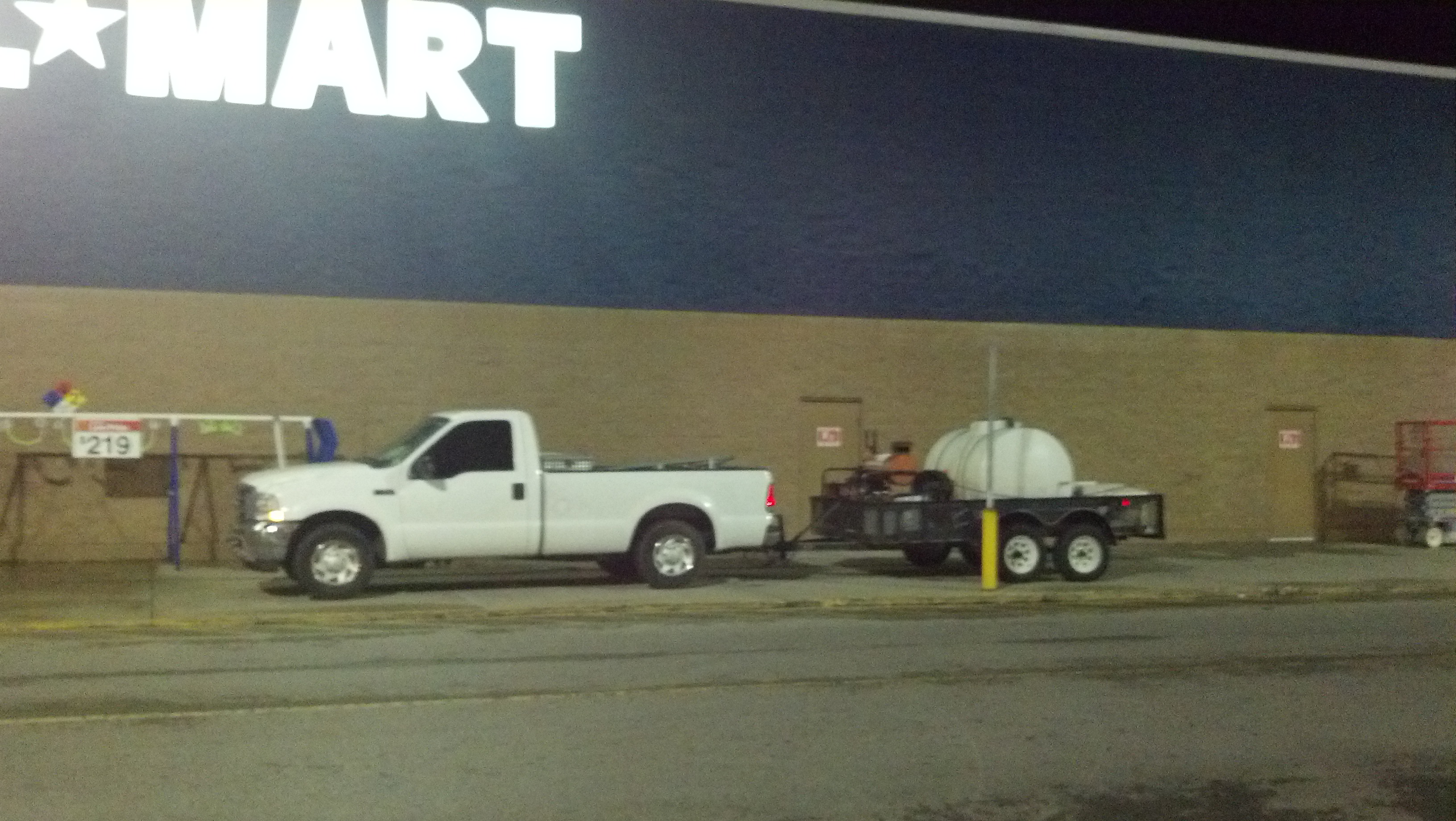 Preferred Painters pressure washing the exterior of this Walmart in Florence Alabama, preparing it for paintiong.